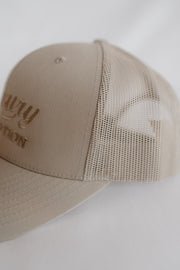 Beige cap with mesh back on a white background