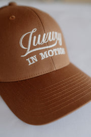 Brown cap with white text on a light background