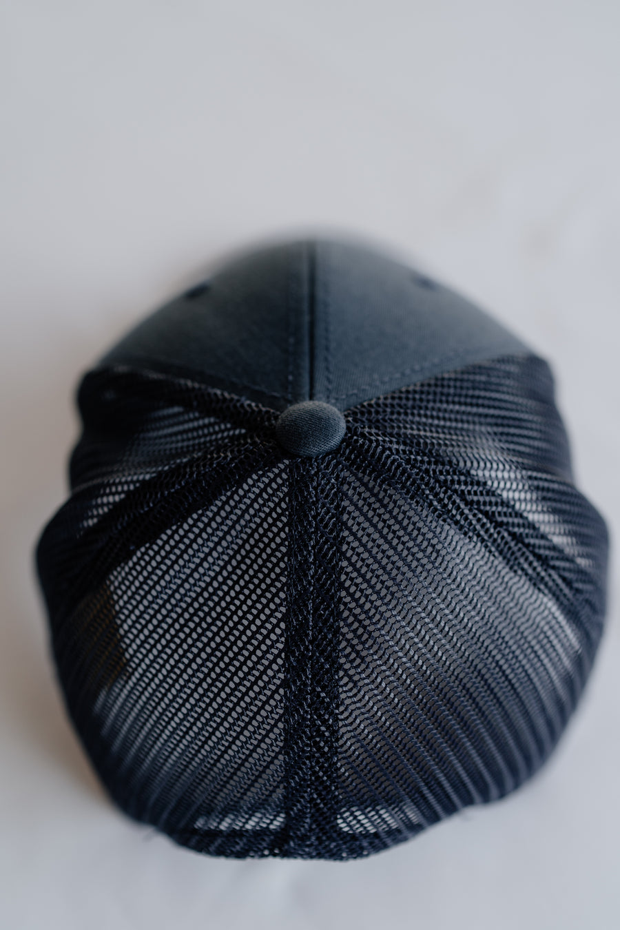 Navy blue textured cap on a white background