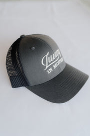 Grey cap with text on a white background