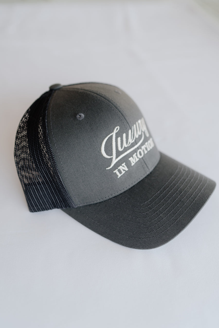 Grey cap with text on a white background